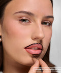 Peel-Off Lip Liner – on model, peeling off the liner