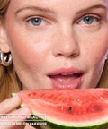 Sweet Treat Lip Oil in Melon Paradise – on model with watermelon